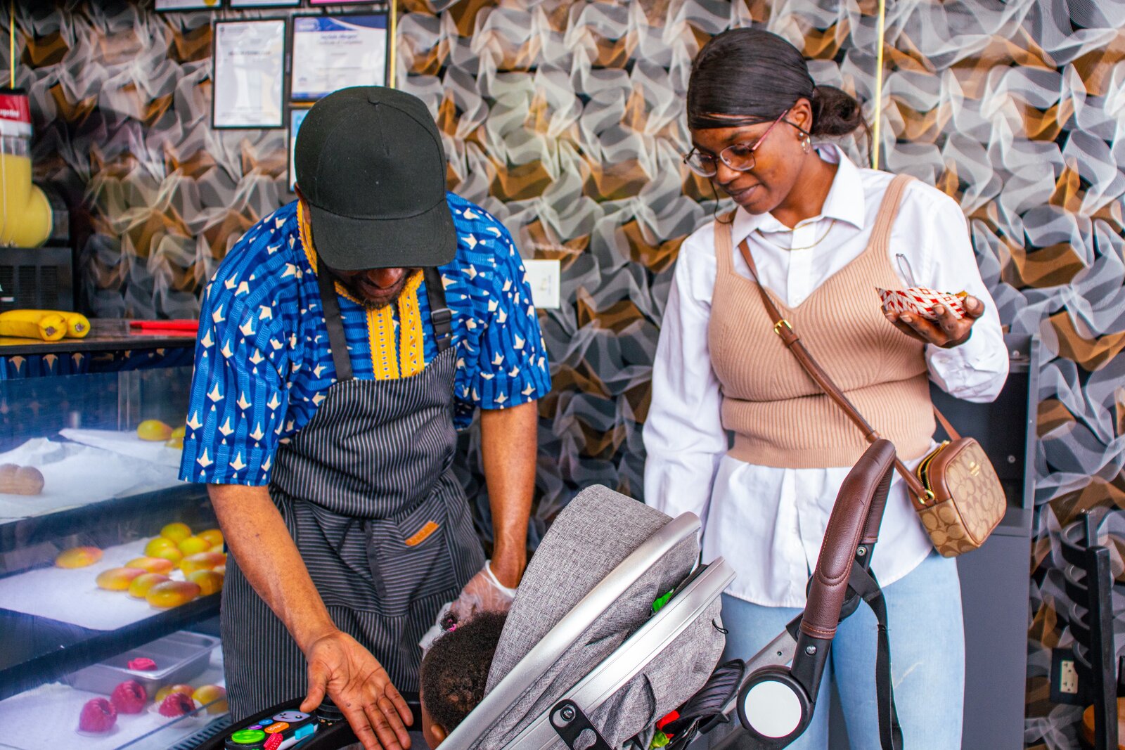 A Teranga Grill team member helping a community member at the counter