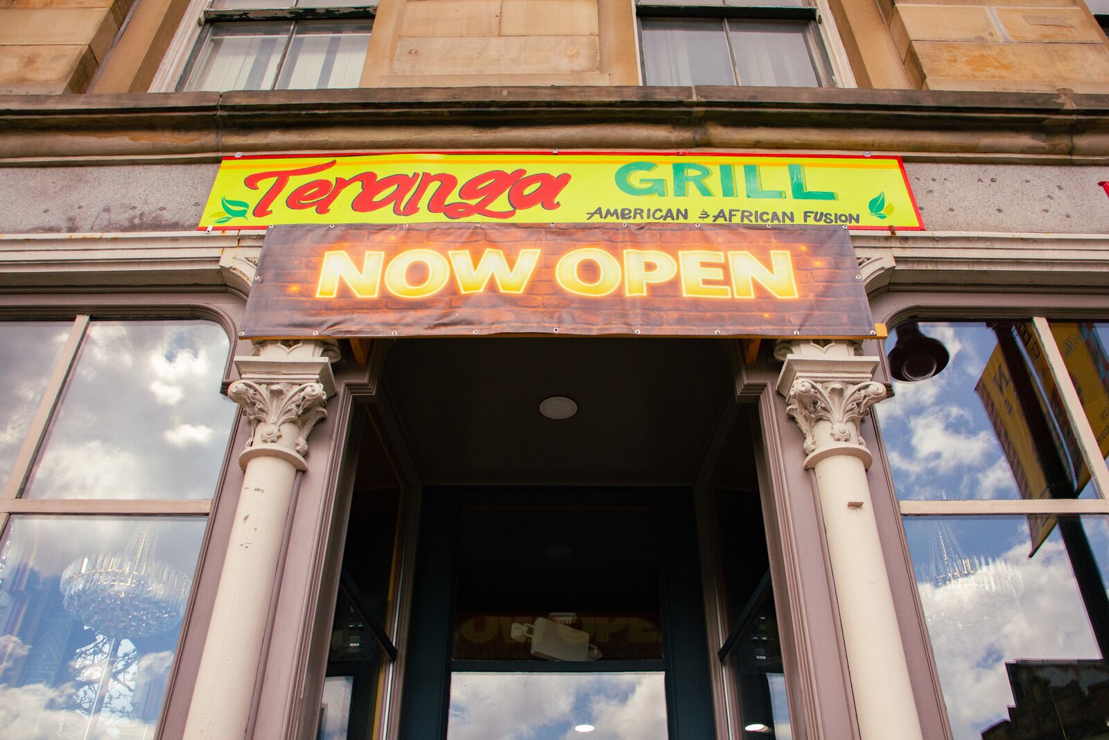 Close-up of the Teranga Grill entrance and sign