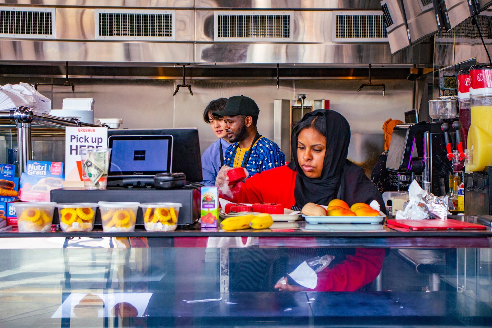 Team members at work behind the counter